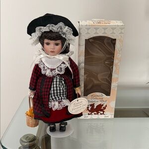 Porcelain Doll in Red and Black Outfit